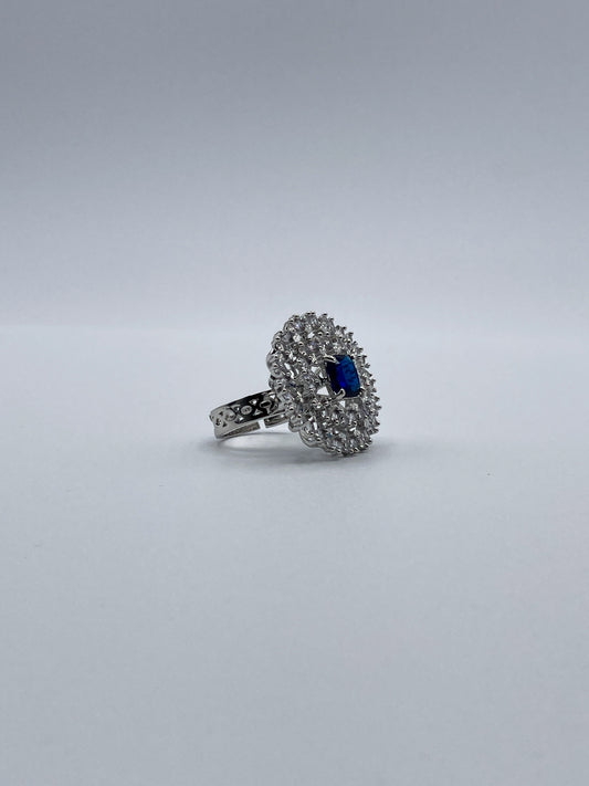 Adjustable Silver-Tone Ring with Blue Center Stone